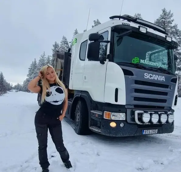 Angelica Larsson in front of her truck, Sweden