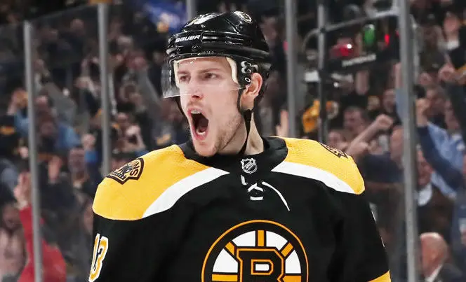 Charlie Coyle on-filed wearing Bruins' jersey