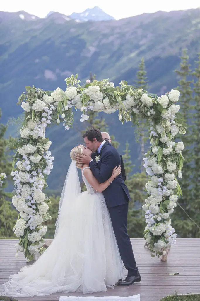 Bradford kissing his wife Emma during their wedding ceremony