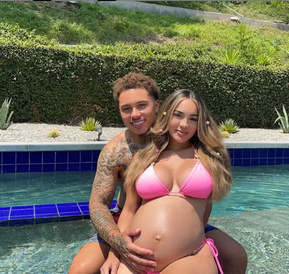 Juju & Des flaunting the baby bump while chilling in the pool