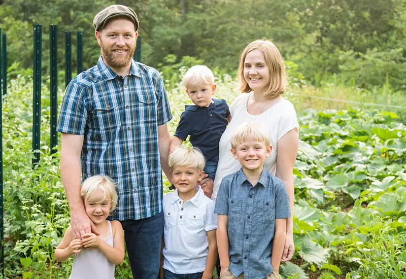 Justin and his wife with their children