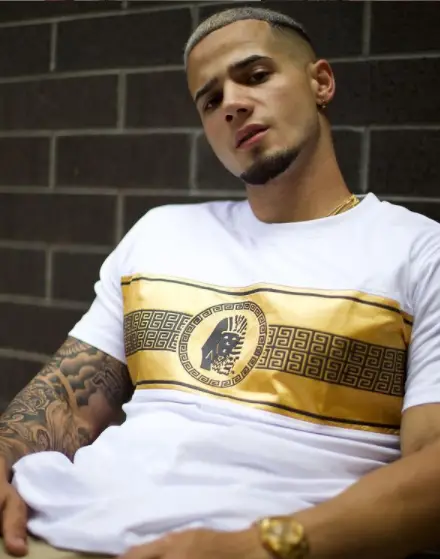 Jordan Torres posing in a Versace t-shirt